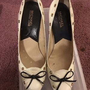 Off white/black Michael Kors pumps.
